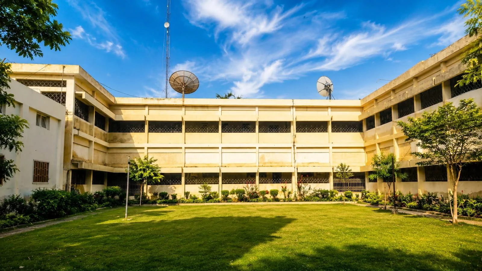 Faculty building and green campus lawn